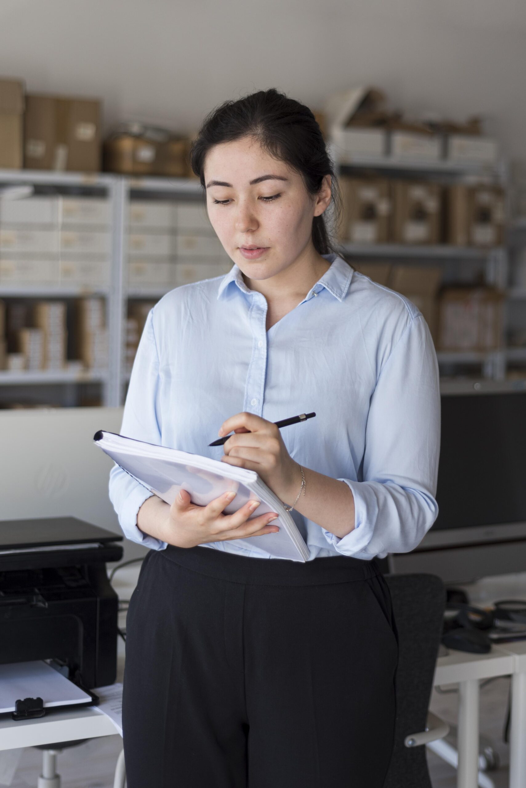 Medium shot business woman reading project