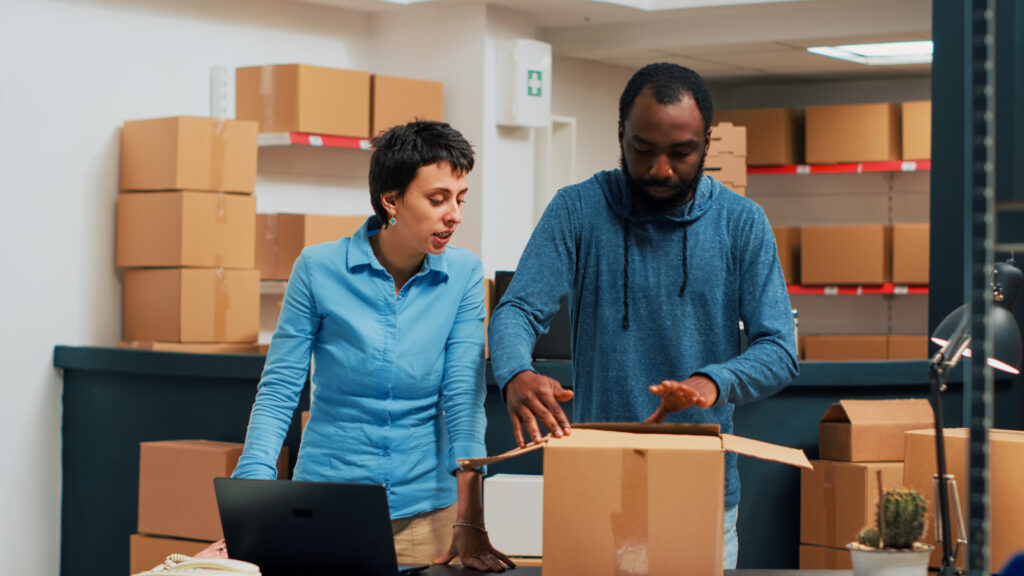 Team of owners doing highfive gesture after preparing storehouse order